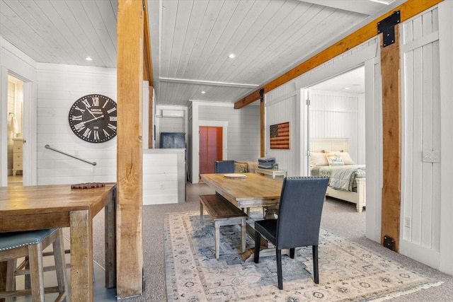 dining area featuring carpet, wooden ceiling, recessed lighting, and a barn door