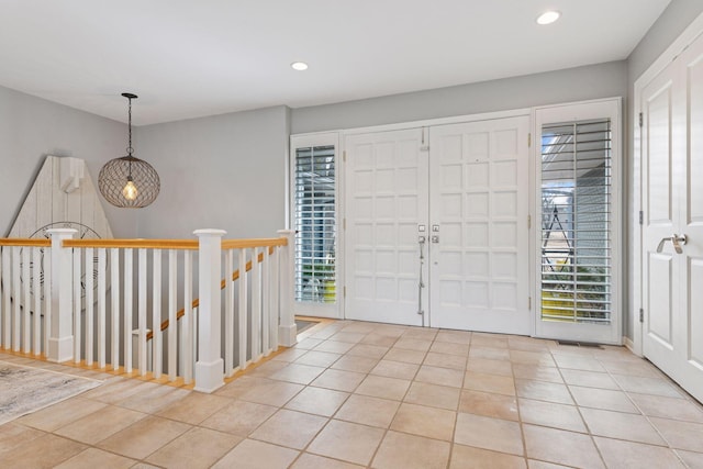 tiled entrance foyer with recessed lighting and plenty of natural light