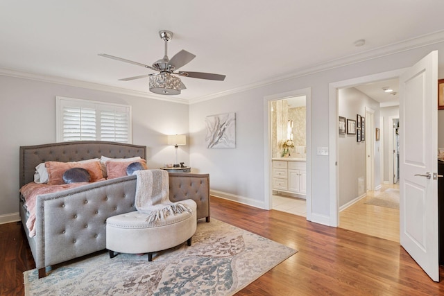 bedroom featuring crown molding, baseboards, and wood finished floors