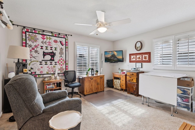 office space featuring a textured ceiling and a ceiling fan