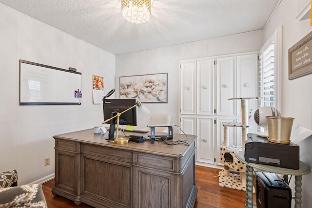 office space featuring dark wood-style floors, a textured ceiling, and an inviting chandelier