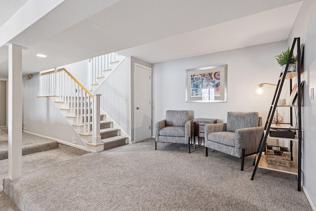 sitting room with stairs, recessed lighting, carpet flooring, and baseboards