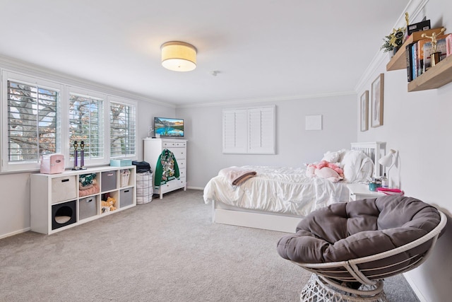 carpeted bedroom featuring ornamental molding and baseboards