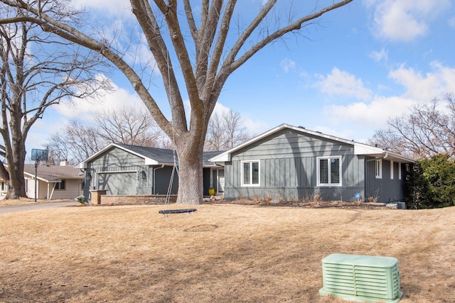 view of front of home with board and batten siding and brick siding