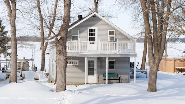 24932 Wall Lake Point Cir, Fergus Falls, MN 56537 - view of front facade with fence and a balcony