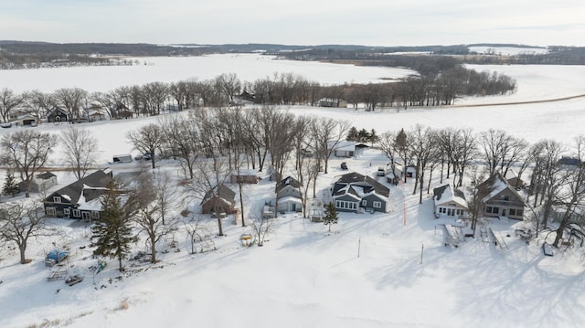 snowy aerial view with a residential view