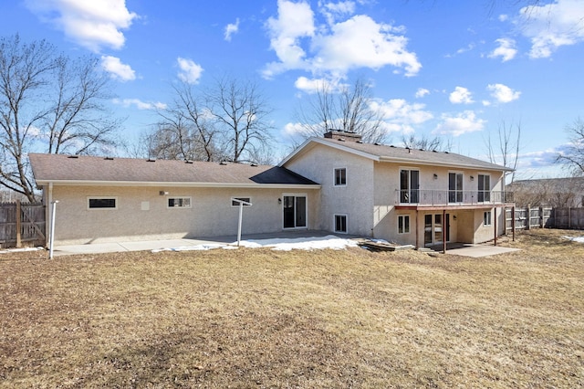 back of house with stucco siding, a patio, and fence