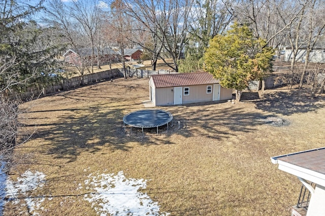 view of yard with an outbuilding and fence