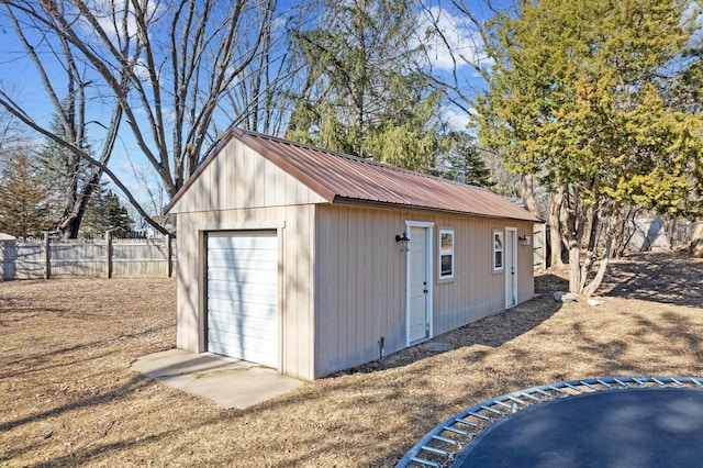 view of outbuilding with an outbuilding and fence