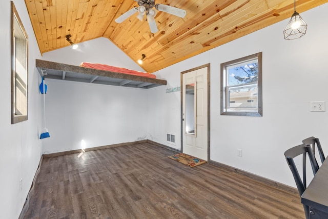 interior space with visible vents, dark wood finished floors, ceiling fan, vaulted ceiling, and wood ceiling