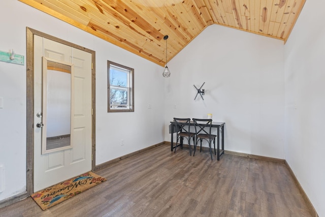 foyer entrance with lofted ceiling, wood finished floors, wood ceiling, and baseboards