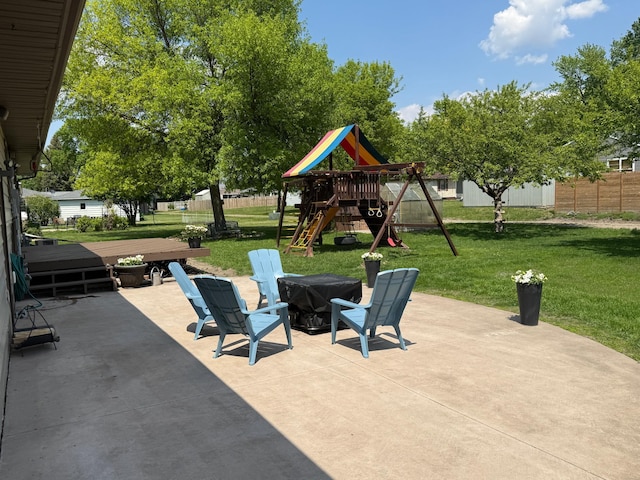 502 19th St N, Benson, MN 56215 - view of patio with a playground and a fire pit