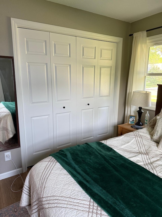 502 19th St N, Benson, MN 56215 - bedroom with a closet, baseboards, and wood finished floors