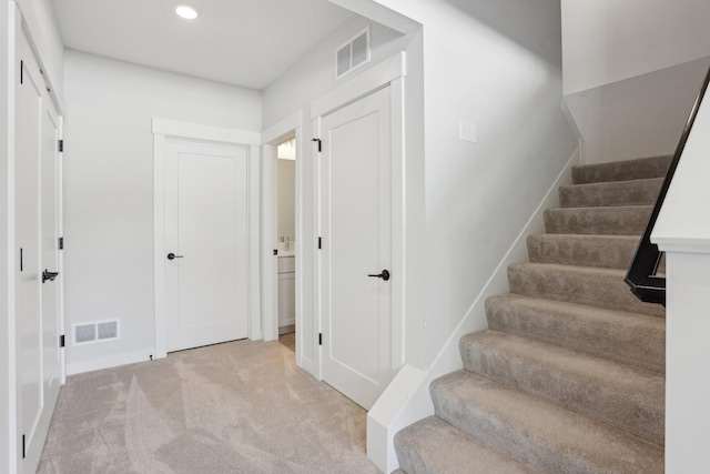 stairs featuring recessed lighting, baseboards, visible vents, and carpet flooring