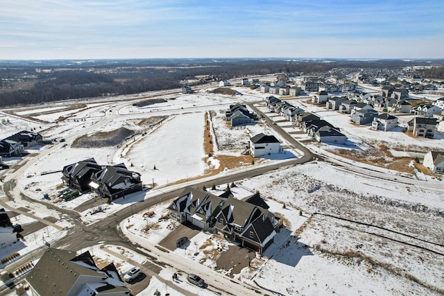 snowy aerial view with a residential view