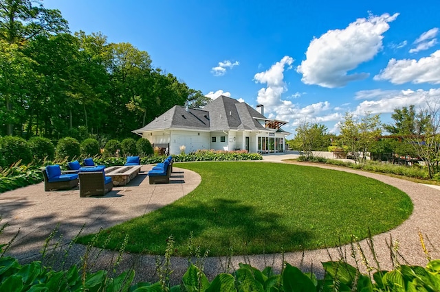 back of house featuring an outdoor hangout area, a yard, and a patio