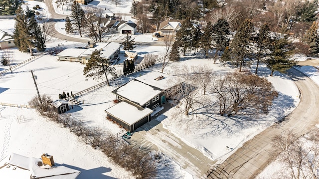 snowy aerial view with a residential view