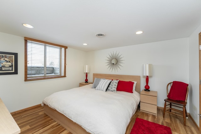 bedroom with visible vents, light wood-style flooring, and recessed lighting