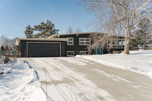 view of front of home featuring board and batten siding and a garage