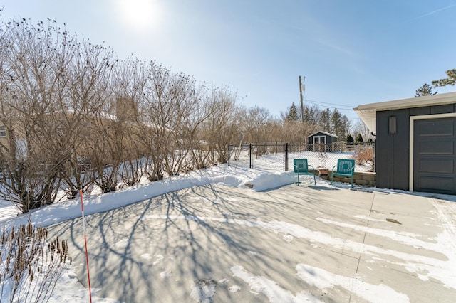 exterior space with an outdoor structure and fence