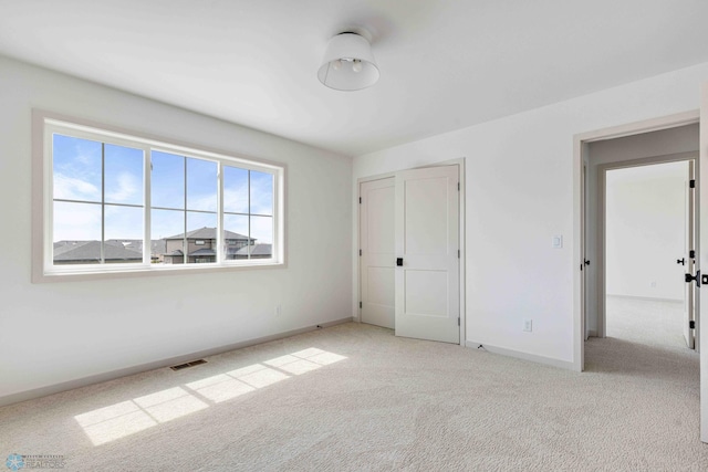3254 Timber Creek Cir S, Fargo, ND 58104 - unfurnished bedroom with light colored carpet, baseboards, and a closet