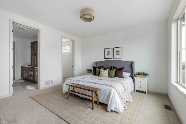 3254 Timber Creek Cir S, Fargo, ND 58104 - carpeted bedroom with baseboards and ensuite bath
