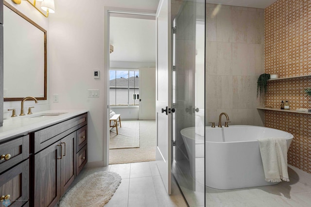 3254 Timber Creek Cir S, Fargo, ND 58104 - full bathroom featuring tile walls, vanity, tile patterned flooring, and a freestanding tub
