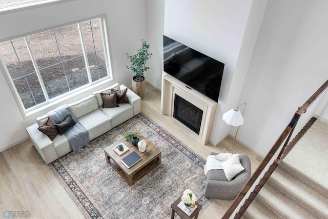 3254 Timber Creek Cir S, Fargo, ND 58104 - living room featuring wood finished floors, a fireplace, and baseboards