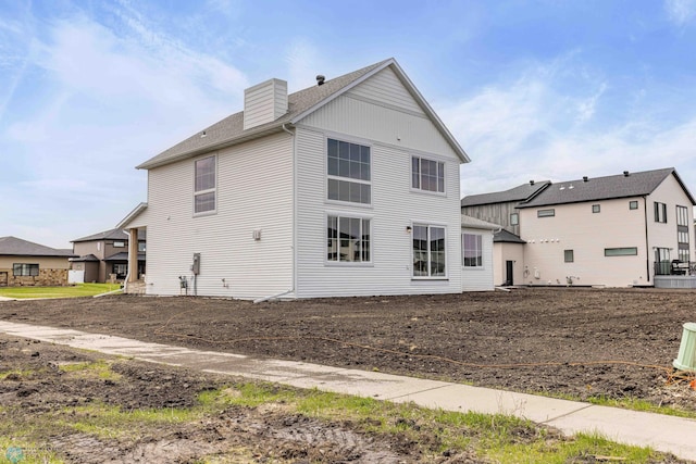 3254 Timber Creek Cir S, Fargo, ND 58104 - view of side of property with a chimney and roof with shingles