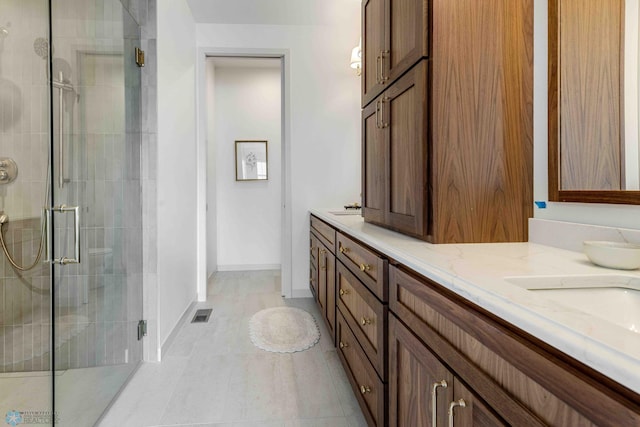 3254 Timber Creek Cir S, Fargo, ND 58104 - full bath featuring a stall shower, double vanity, and tile patterned floors