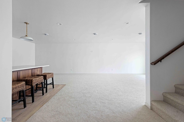 3254 Timber Creek Cir S, Fargo, ND 58104 - sitting room featuring stairway and light colored carpet
