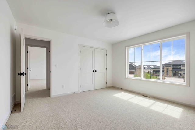 3254 Timber Creek Cir S, Fargo, ND 58104 - unfurnished bedroom with carpet flooring, baseboards, and a closet