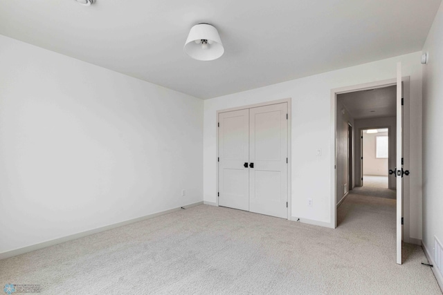 3254 Timber Creek Cir S, Fargo, ND 58104 - unfurnished bedroom featuring light carpet, baseboards, and a closet