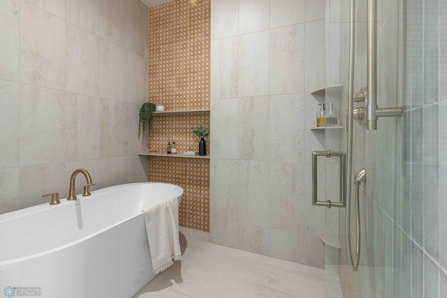 3254 Timber Creek Cir S, Fargo, ND 58104 - full bath with tile walls, tiled shower, and a freestanding tub