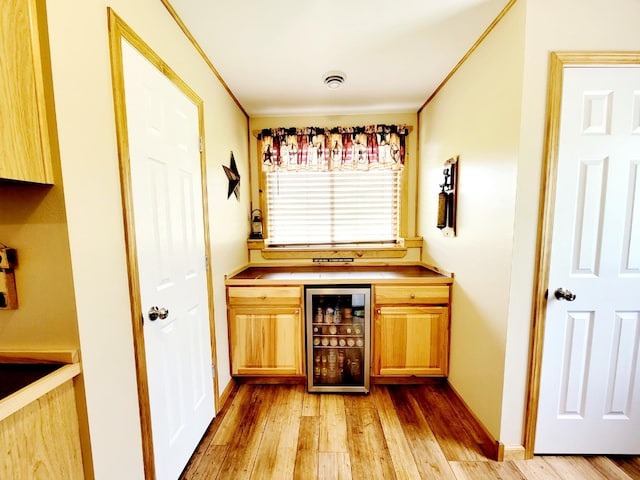 409 Hummingbird Ln, New York Mills, MN 56567 - bar featuring light wood finished floors, a dry bar, and wine cooler