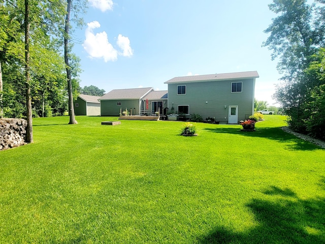 409 Hummingbird Ln, New York Mills, MN 56567 - back of property featuring a lawn