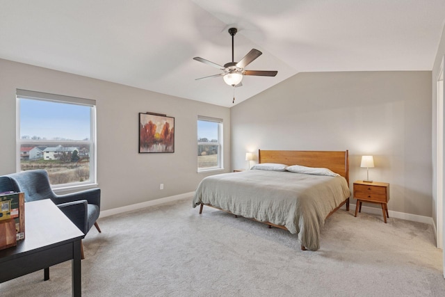 carpeted bedroom featuring ceiling fan, baseboards, and vaulted ceiling