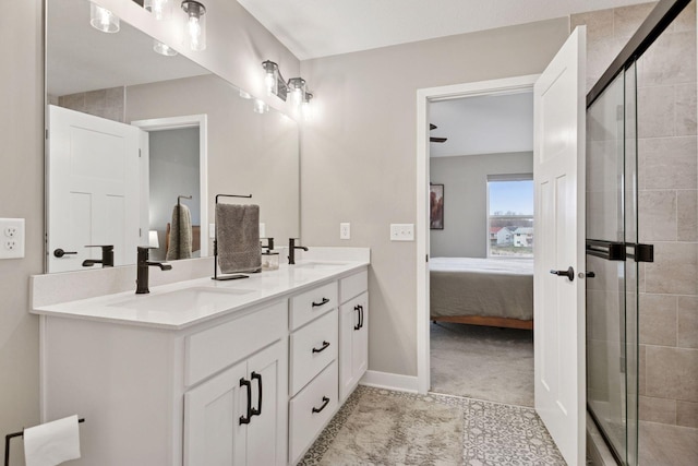 ensuite bathroom featuring a sink, ensuite bath, and a stall shower