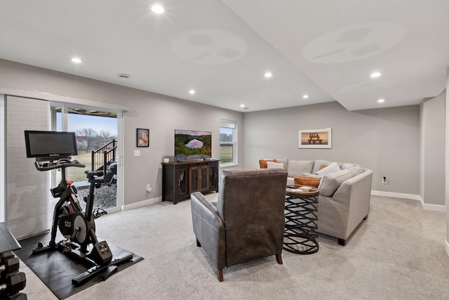 living room featuring light colored carpet, baseboards, and recessed lighting