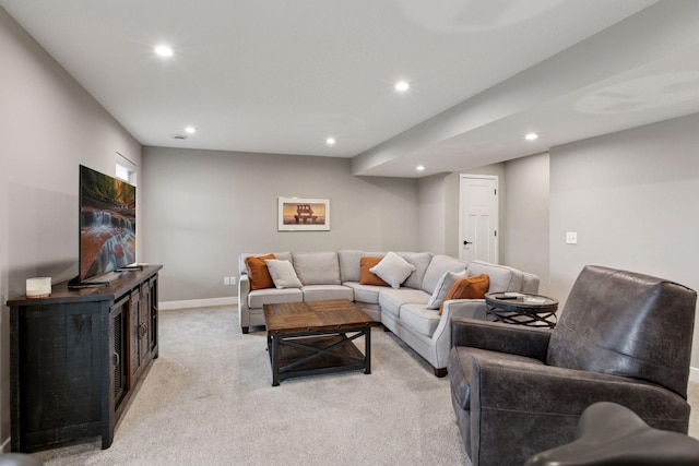 living room featuring recessed lighting, light colored carpet, and baseboards