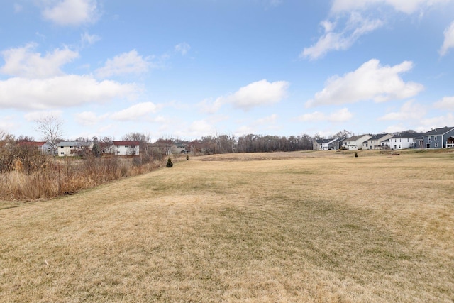 view of yard featuring a residential view