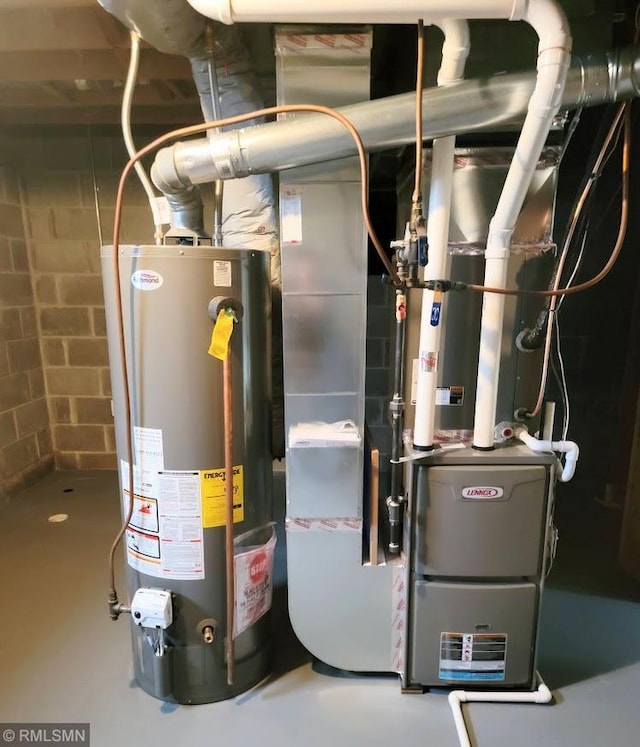 utility room featuring water heater