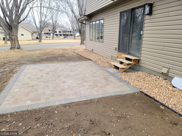 exterior space with entry steps and a residential view