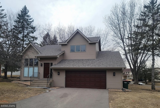 view of front of property with a garage, aphalt driveway, and roof with shingles