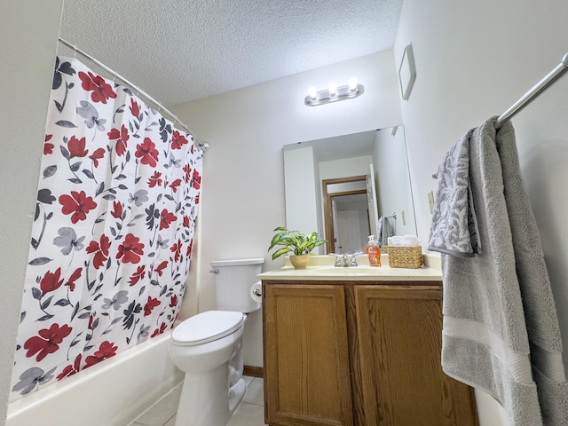 full bath with toilet, vanity, a textured ceiling, and tile patterned floors