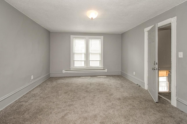 unfurnished room with a baseboard radiator, carpet flooring, a textured ceiling, and baseboards