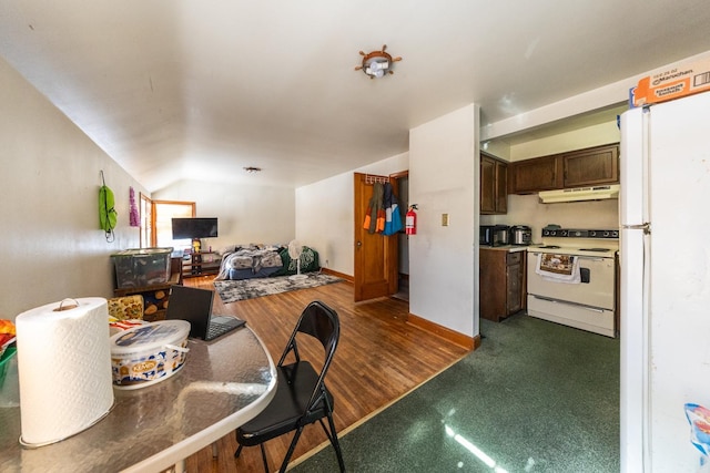 kitchen featuring dark wood-style floors, lofted ceiling, dark brown cabinets, white appliances, and under cabinet range hood