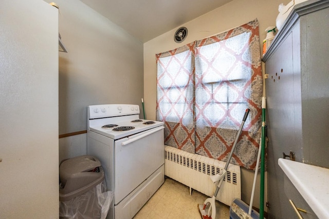 kitchen with light floors, radiator heating unit, and white electric range oven