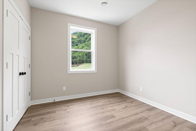585 Cedar Dr, Lake City, MN 55041 - unfurnished bedroom with light wood finished floors and baseboards