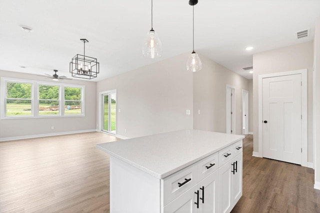 585 Cedar Dr, Lake City, MN 55041 - kitchen with light wood-style floors, a ceiling fan, light countertops, open floor plan, and decorative light fixtures